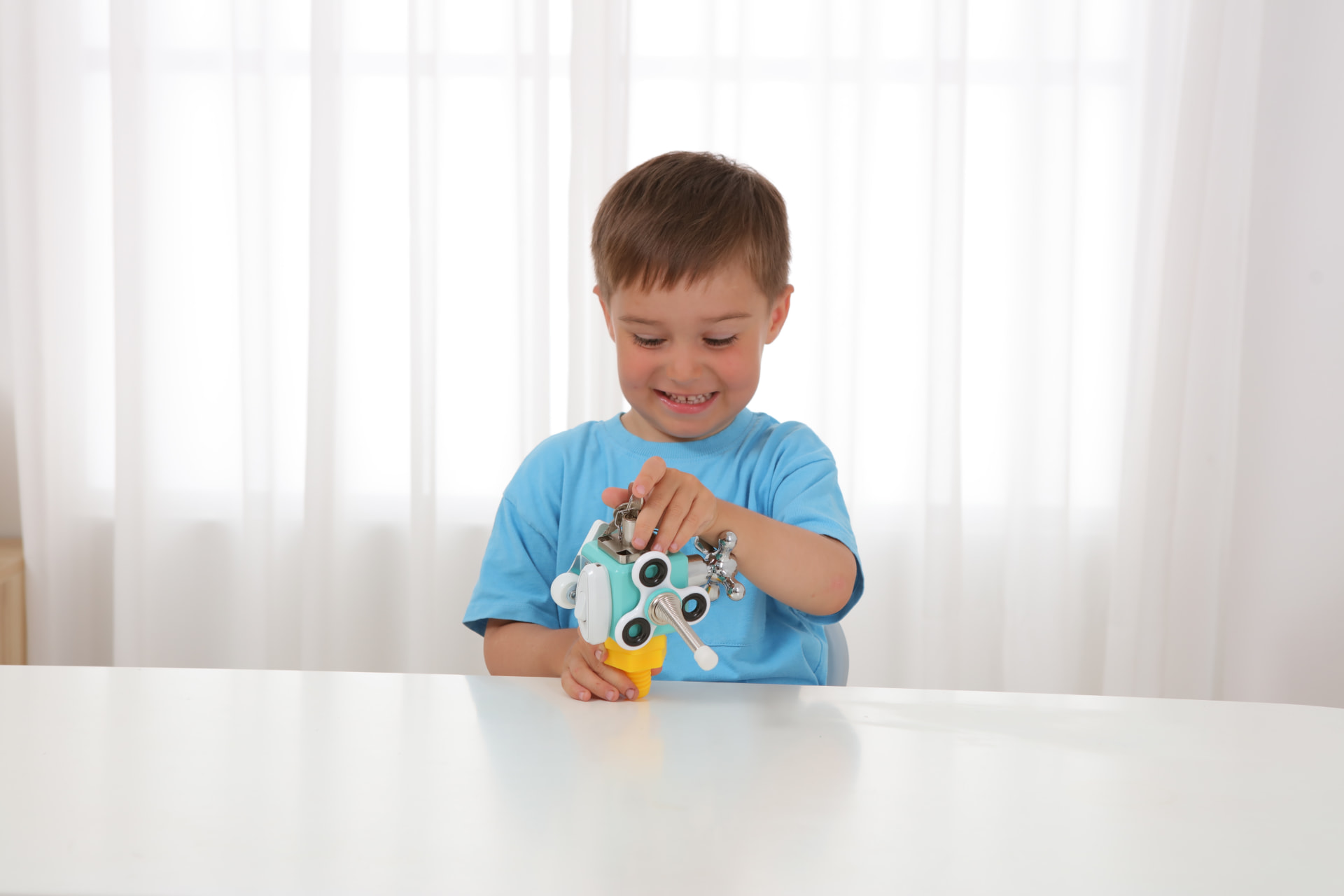 Jumble Cube wooden activity cube with shape sorter and spinning gears for toddlers