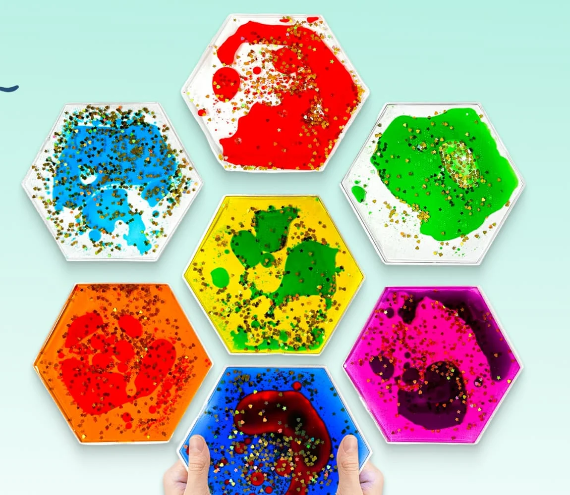 All seven Jumble Comb liquid motion tiles arranged in a honeycomb