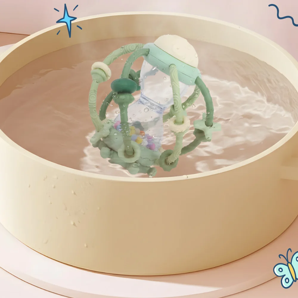 Jumble Jiggle silicone teether being rinsed clean under running water
