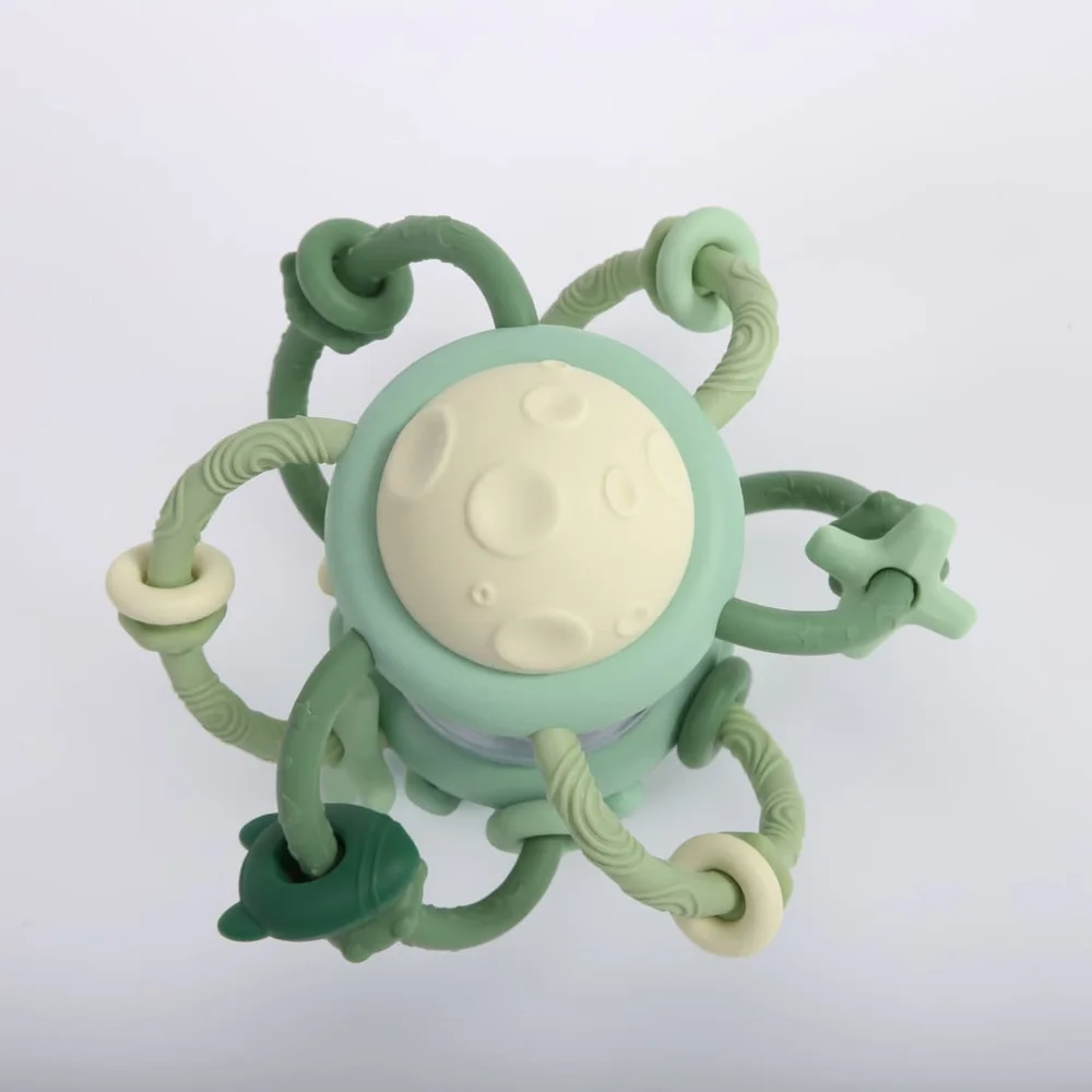 Close-up of the moon and star textures on the Jumble Jiggle teether